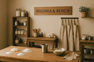 Finely Crafted Begonia & Bench Candles next to a white cotton glove