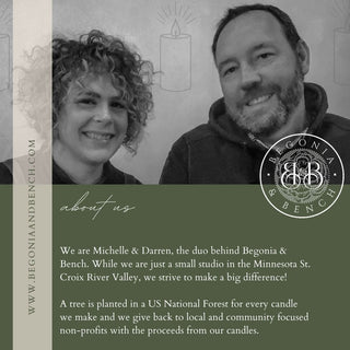 A grayscale photo of a smiling man and woman. Text overlay describes Michelle and Darren from Begonia & Bench®, a Minnesota small business. Their mission includes planting trees for every sale and donating proceeds to local nonprofits. Among their offerings is the Forest & Flannel™ - 12oz Finely Crafted Scented Candle. Begonia & Bench's logo is displayed.