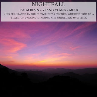 A serene landscape at twilight with a vibrant sky in shades of pink, orange, and purple over silhouetted rolling hills. At the top, text reads "NIGHTFALL™" followed by "PALM RESIN - YLANG YLANG - MUSK," describing the 12oz finely crafted scented candle by Begonia & Bench® that embodies twilight's essence.