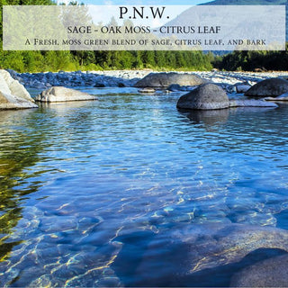 A tranquil river scene showcases clear water cascading over rocks, with majestic mountains and evergreen trees in the backdrop. The text at the top reads "P.N.W. Sage - Oak Moss - Citrus Leaf." This 12oz finely crafted scented candle by Begonia & Bench® captures the essence of fall with its fresh, moss green blend of sage, citrus leaf, and bark.